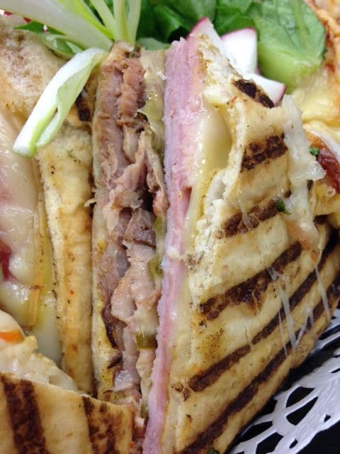 Grilled Cuban panini with roast pork, ham and Swiss