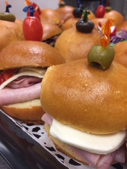 Mini sandwiches on sweet rolls for a catered meeting