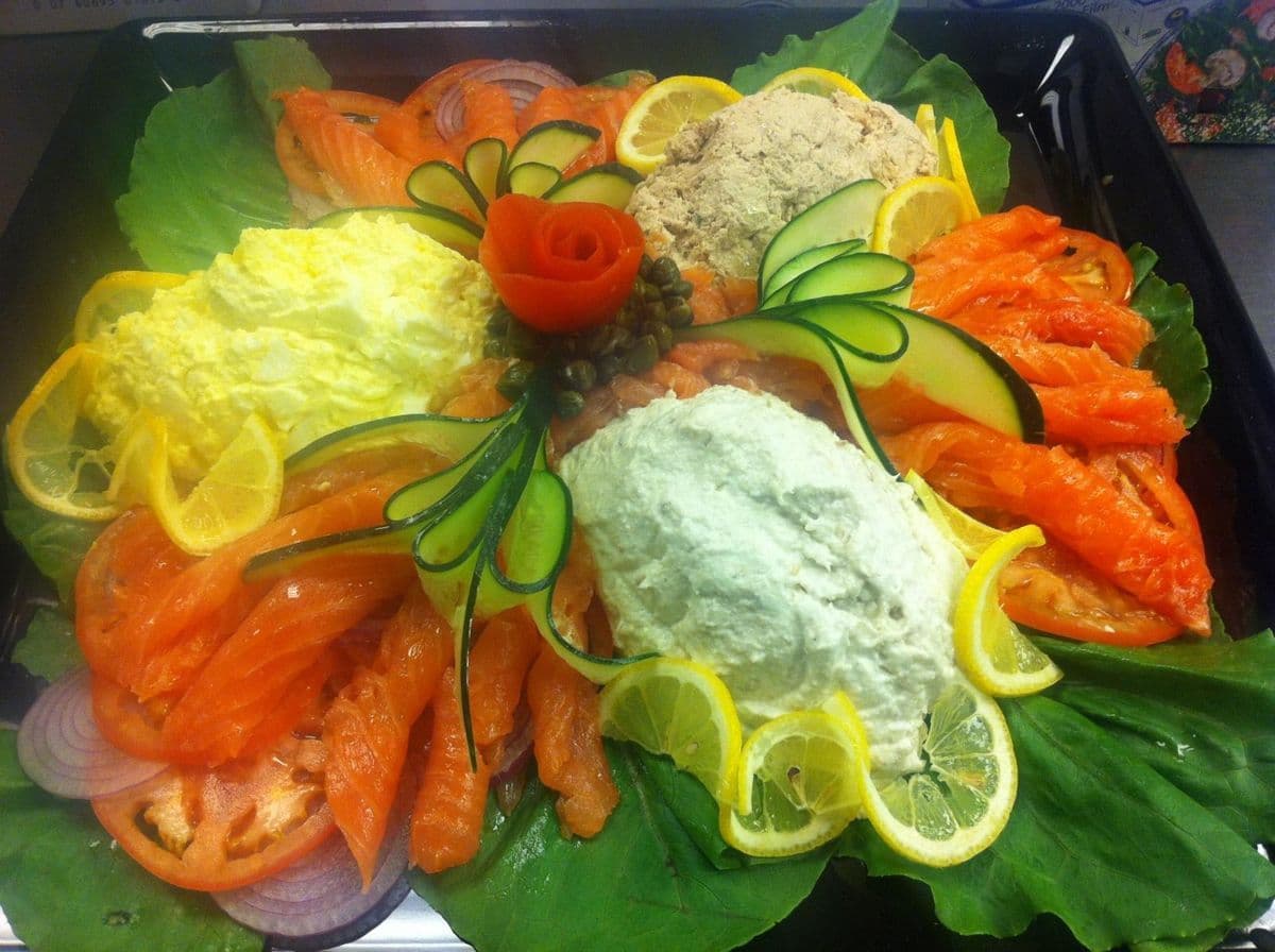Whitefish, tuna and egg salad platter garnished for a bagel catering spread